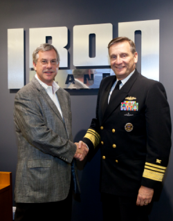 Vice Admiral Mark Harnitchek and Greg Owens at IronPlanet headquarters on auction day. 