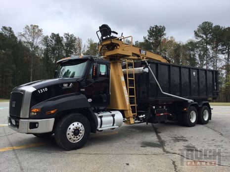 Prentice 2124BC Grapple Loader on 2014 Cat CT660S Roll Off Truck