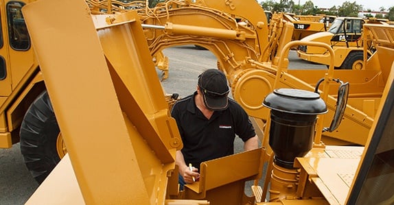 Inspecting-heavy-equipment-for-sale